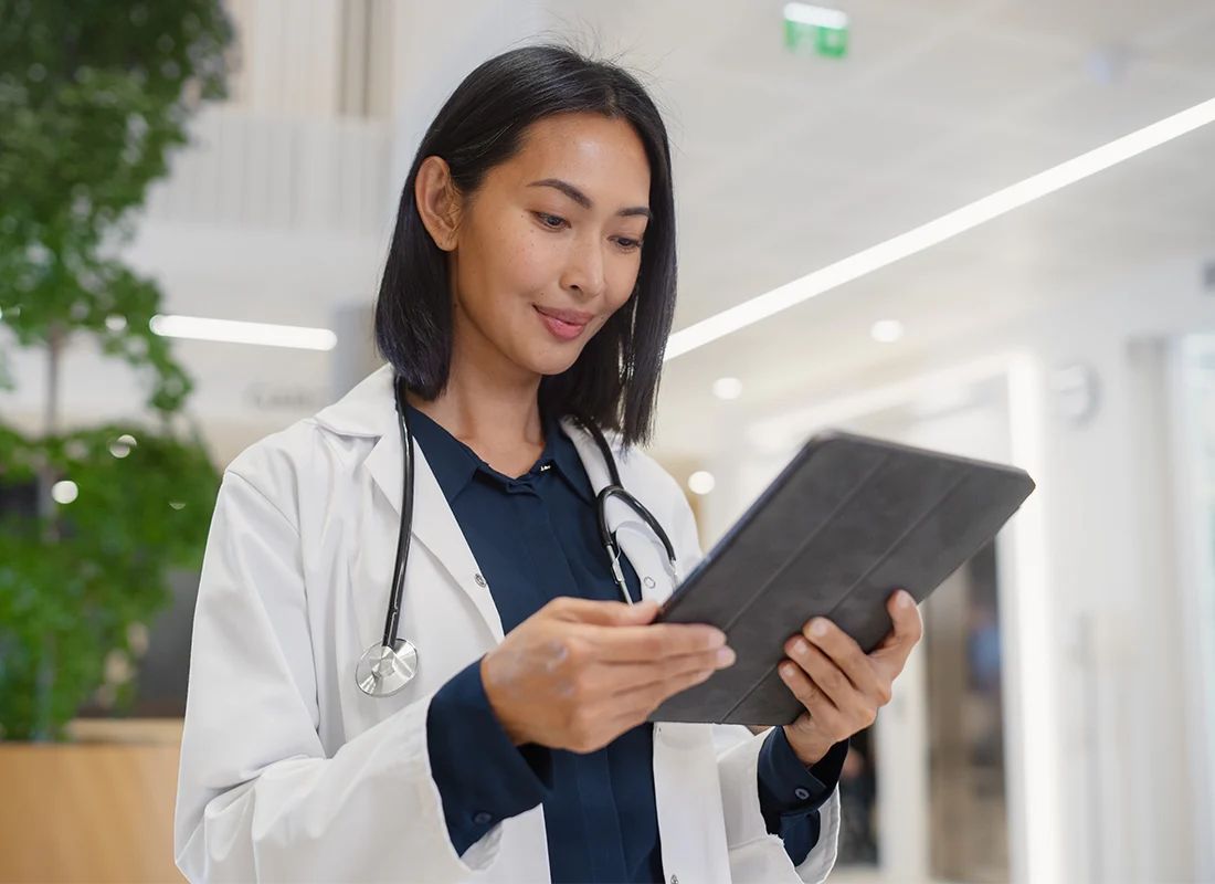 portrait-asian-female-general-practitioner-using