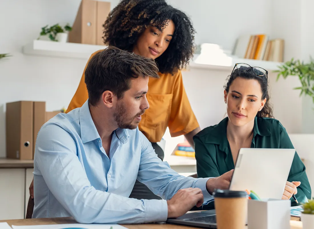shot-business-people-working-laptop-talking